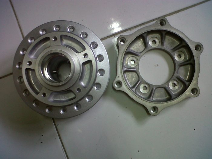 tromol depan supra x-100 dan adaptor cakram tiger 2000